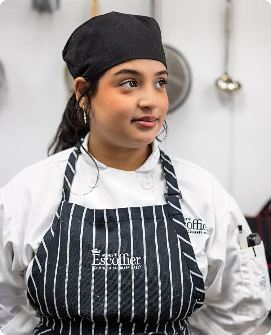 Escoffier student in culinary uniform