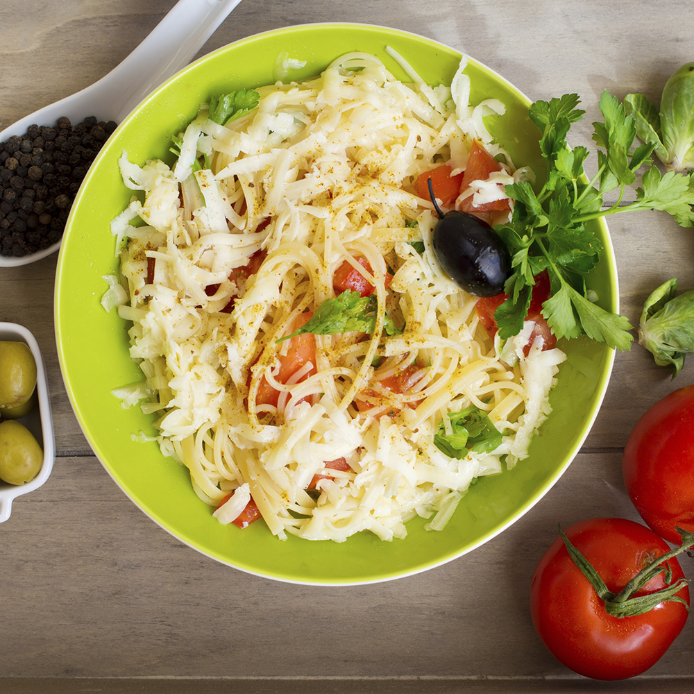 Fresh tomatoes and briney olives are great additions to summer pasta dishes. 