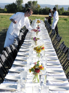 Culinary Arts students setting a table for a farm-to-table dinner