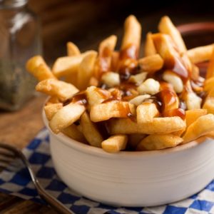 Poutine is among the new terms being added to the 2014 Merriam-Webster Collegiate Dictionary.