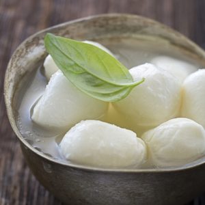 You can shape mozzarella into minuscule balls, a log or one large section, depending on how you plan to store it and what you are going to use it for.