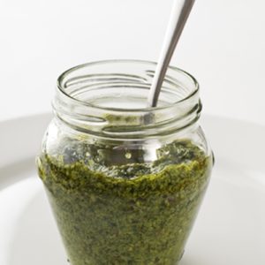 Homemade pesto can be scooped into a jar and kept in the fridge or poured into baggies and frozen for later use.
