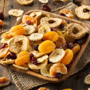 You can make dried fruit to add to trail mix at home with the use of an oven or a dehydrator. 