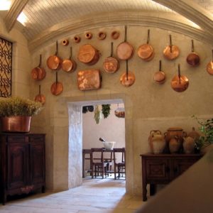 Copper cookware on a wall