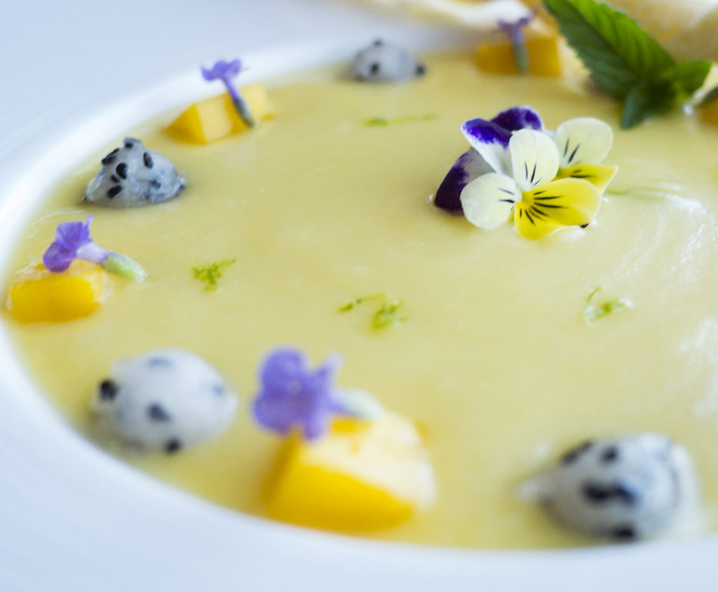 cold fruit soup garnished with flowers