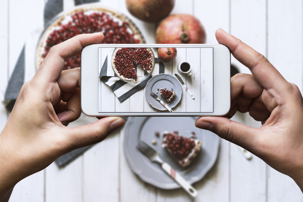 Taking photo of a cut pomegranate pie