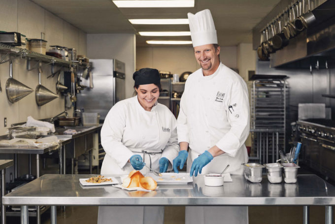 Jimena Peck plating dish with Chef instructor at Escoffier Culinary School in Boulder