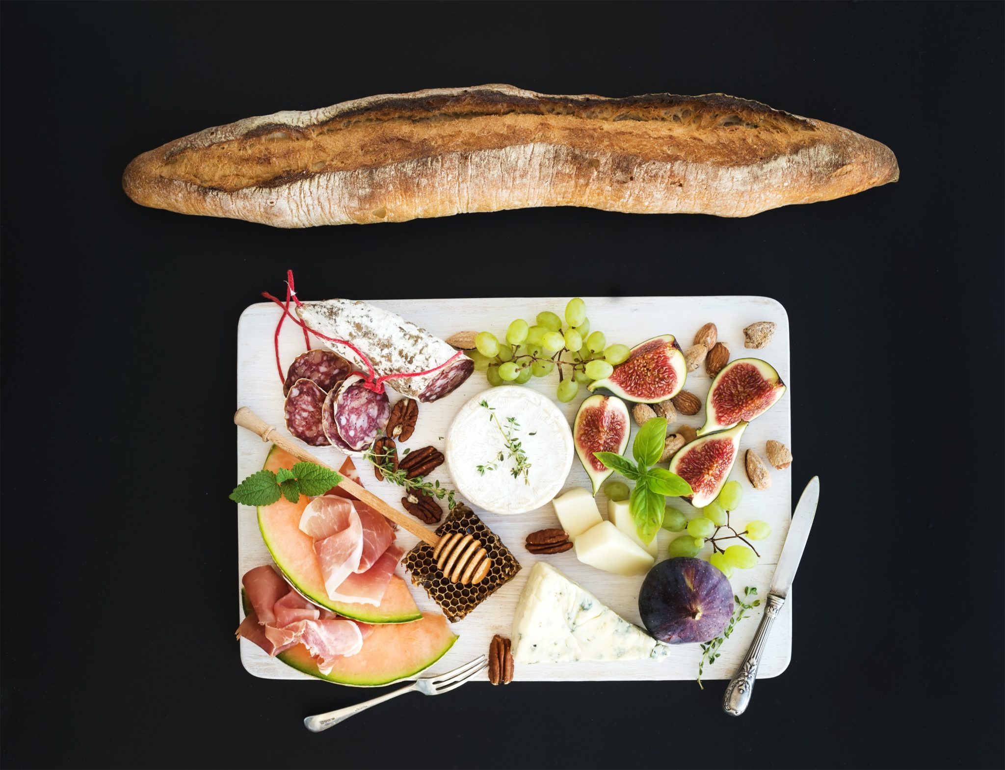 Fruits, cheeses, condiments and cured meats are all great ways to add variety to your charcuterie board.