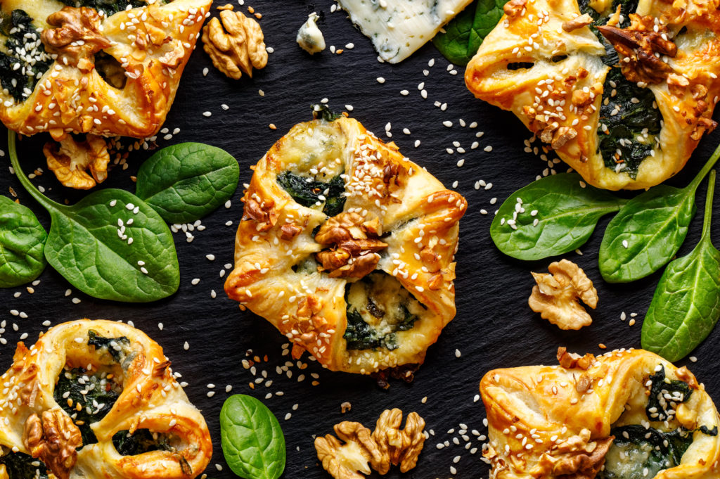 Spinach puffs with addition of Gorgonzola cheese, walnuts and sesame seeds