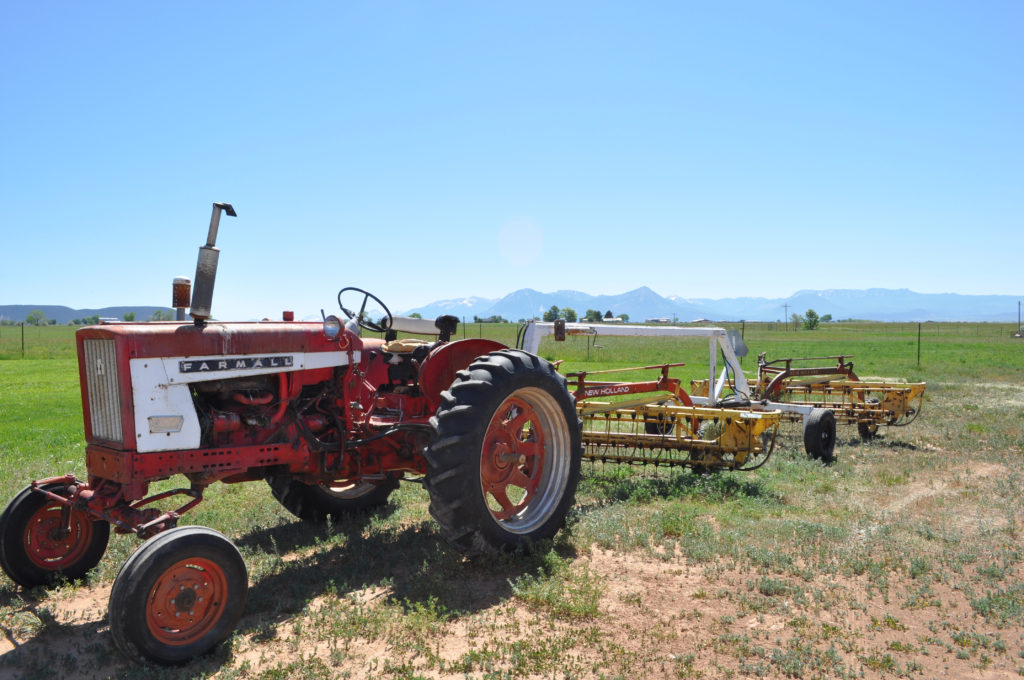Red tractor on a farm outside of Boulder, Colorado