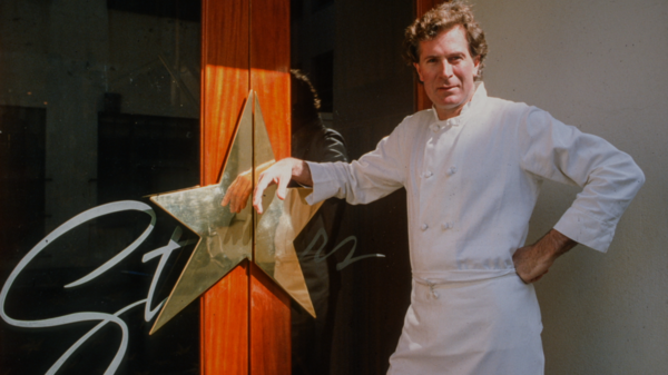 Jeremiah Tower stands in front of the entrance to Stars, a restaurant that set the modern standard for dining. Photo: The Orchard
