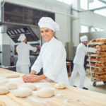 A woman baker working in a bakery