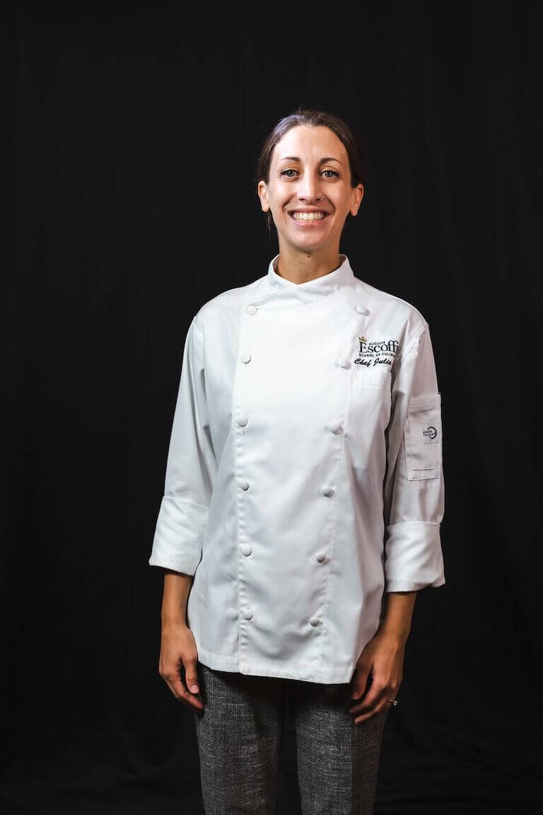 Chef Instructor Julie Clark posing for a photo in uniform