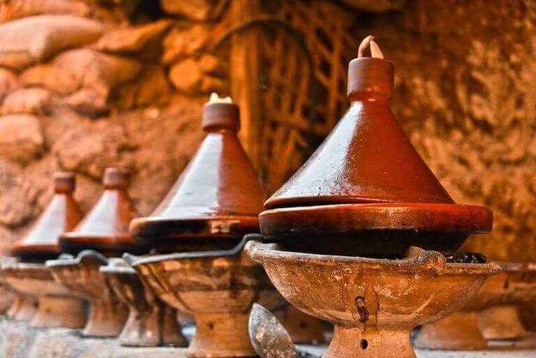 Cooking traditional Moroccan dish, meat and vegetable in tajine