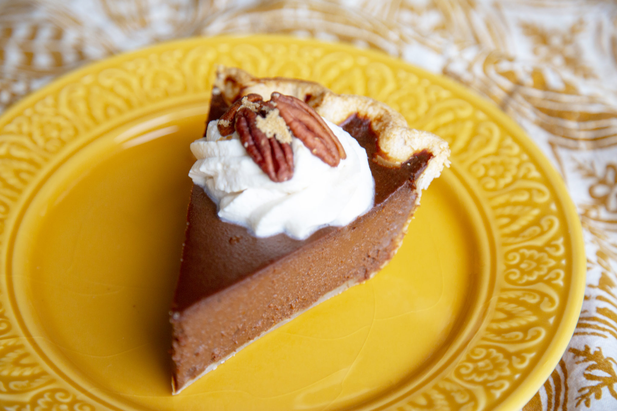 Serve this decadent pie with candied pecans and bourbon whipped cream. 