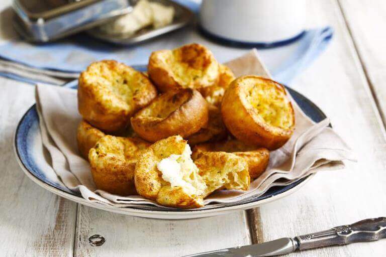 Fresh popovers served on a plate