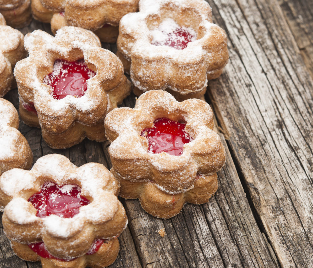 Flower shaped pastry with red filling 