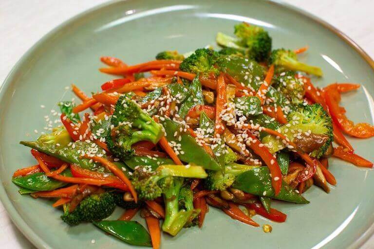 Plant-based stir fry with broccoli, carrots, and other vegetables