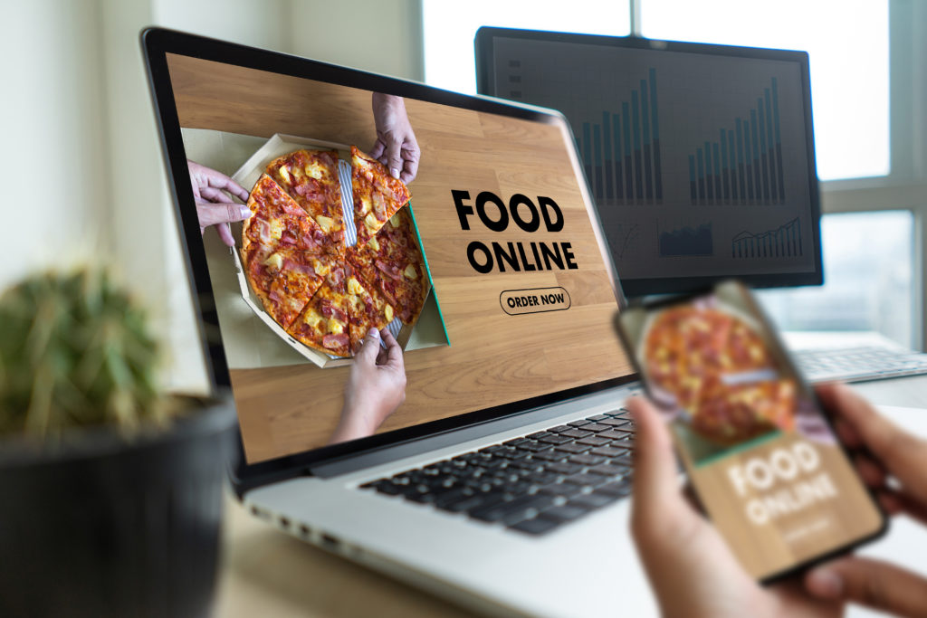 Close up woman ordering pizza online by internet