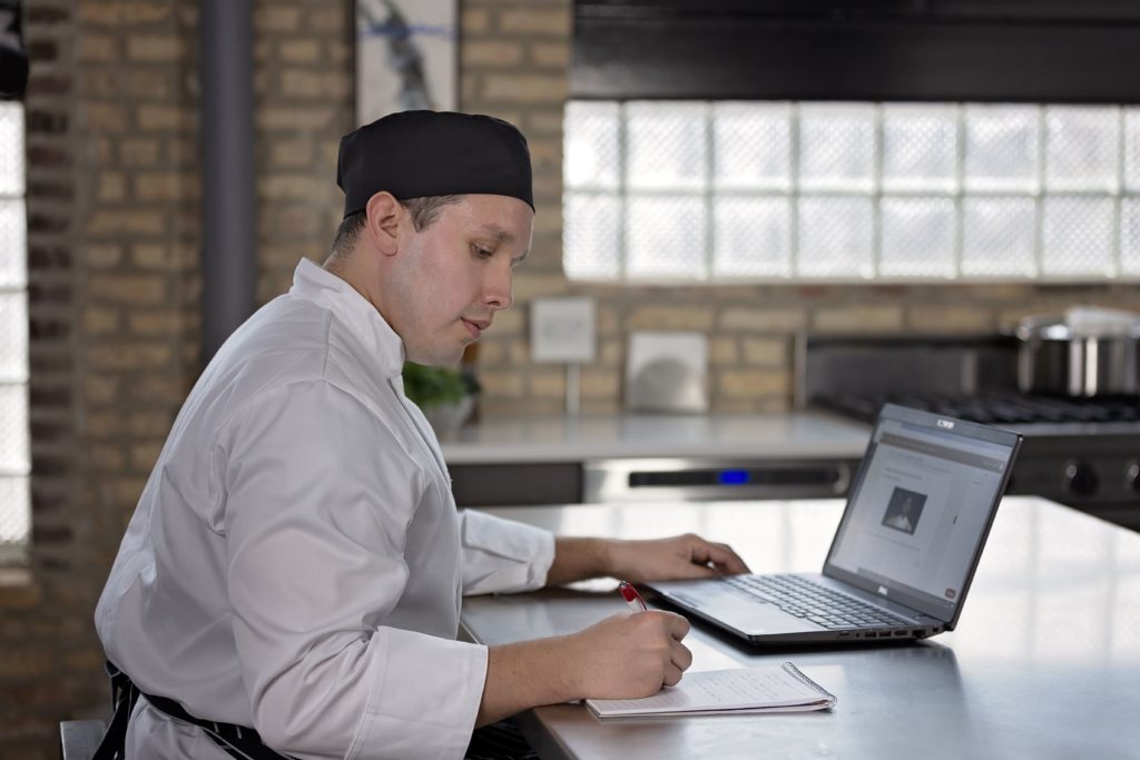  Online-culinary-student-taking-course-on-laptop-computer