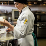 Chef mixing ingredients in a bowl