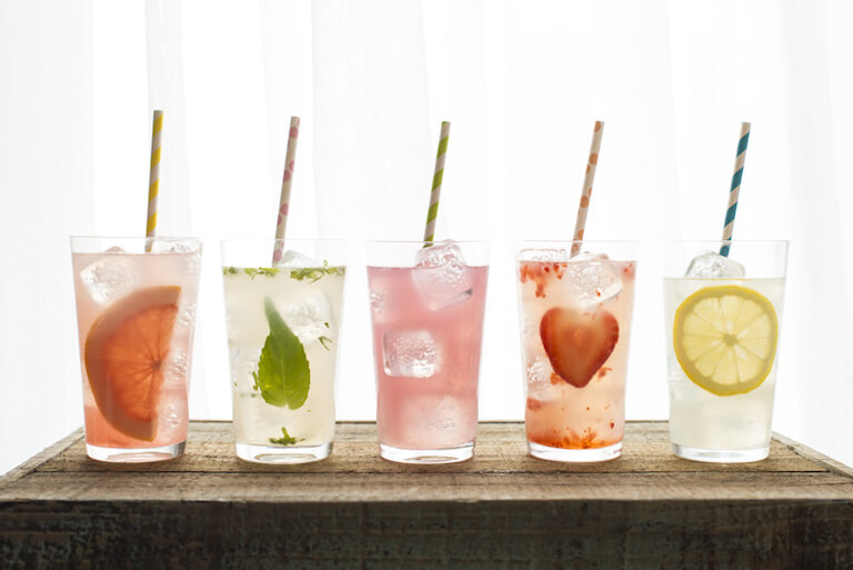 Photo of five glasses with different flavors of lemonade
