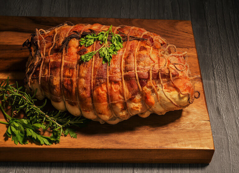 Cooked Turducken on a cutting board 