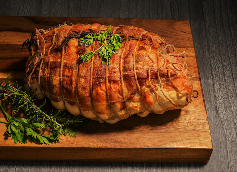 Cooked Turducken on a cutting board