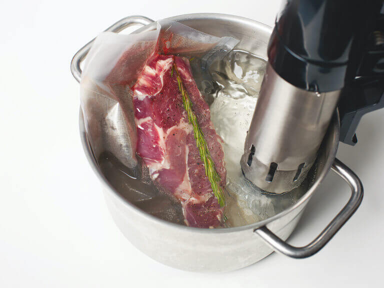 Sous vide meat steak in water immersion circulator