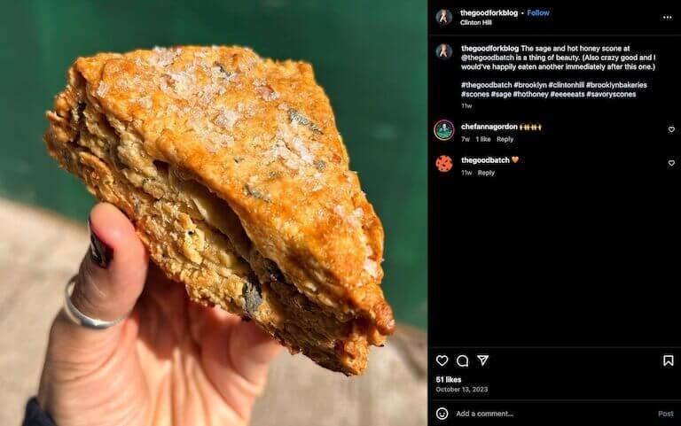 Screenshot of an Instagram post depicting a close-up of a fresh scone topped with flaky sea salt.