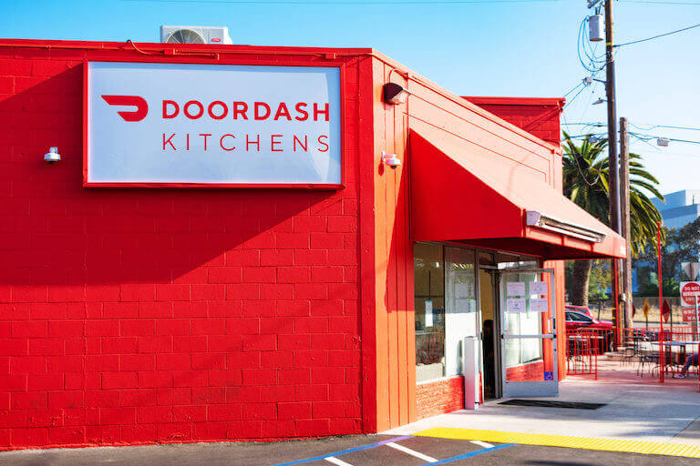 Red building with a large Doordash sign