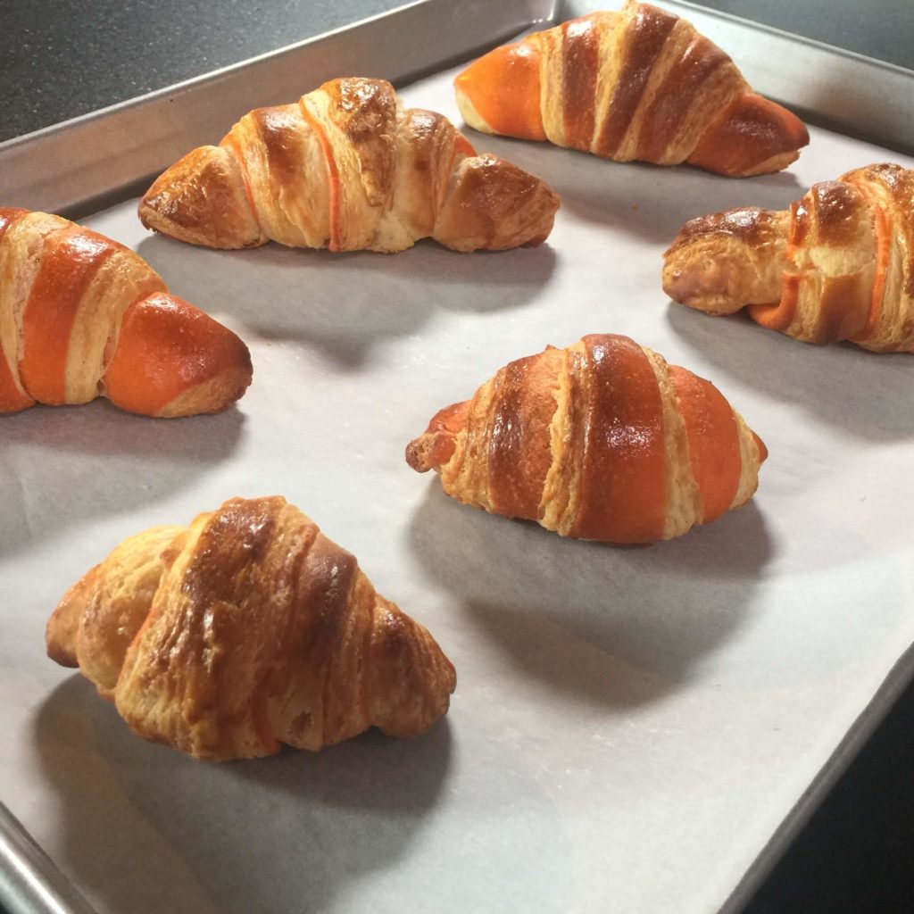 Chef Colette’s flaky homemade croissants on a baking tray