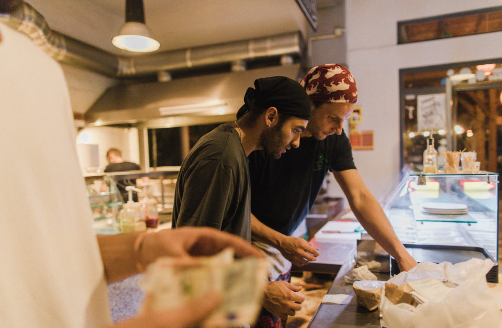 Chefs and cooks in restauraant buffet wearing bandanas on head