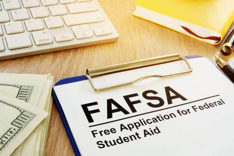 Free Application for Federal Student Aid (FAFSA) on a clipboard