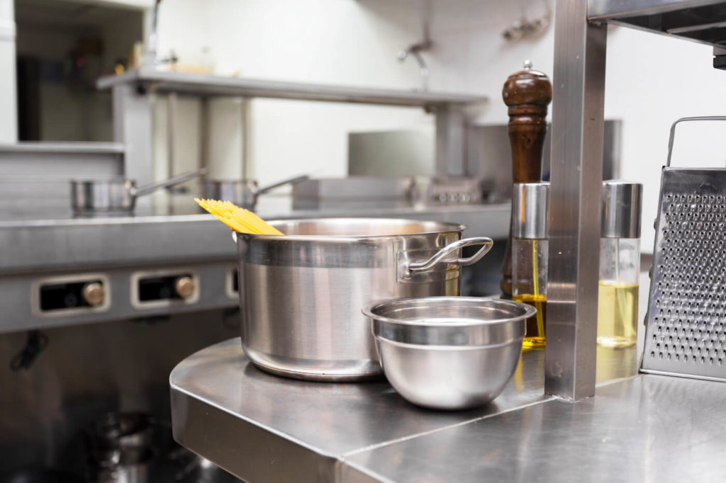 Metal pots and dishes in a restaurant kitchen
