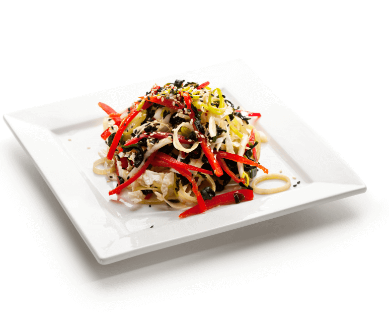 A creative plant-based meal on a white plate
