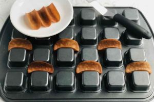 Upside down baking pan with wells to make taco shells