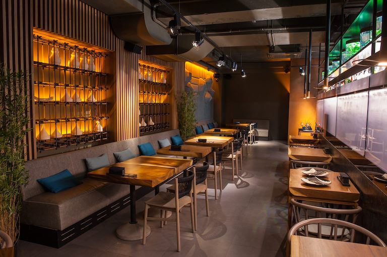 Interior of a dimly lit modern restaurant