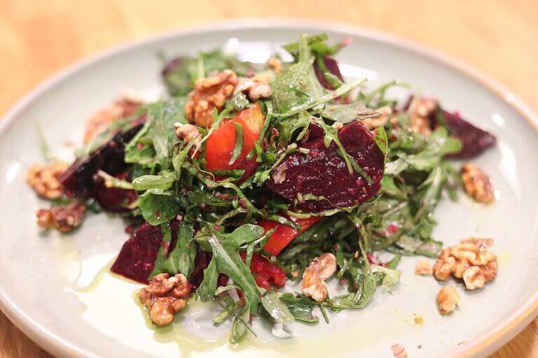 Beet salad with walnuts on a plate