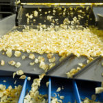 Close-Up Of Potato Chips In Machine