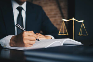 Close up of a lawyer writing in a notebook