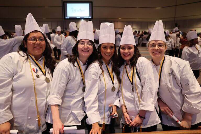 Escoffier students posing for a photo at graduation