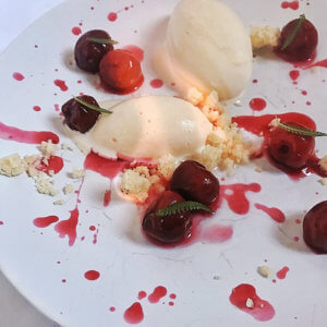 Deconstructed Cherries Jubilee on a white plate
