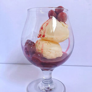 Cherries Jubilee served in a glass