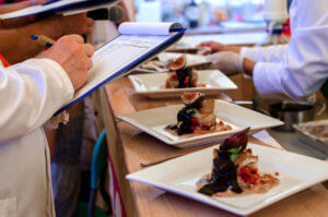 Judge ranks food at a competition