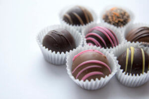 Close-up photo of seven chocolate truffles