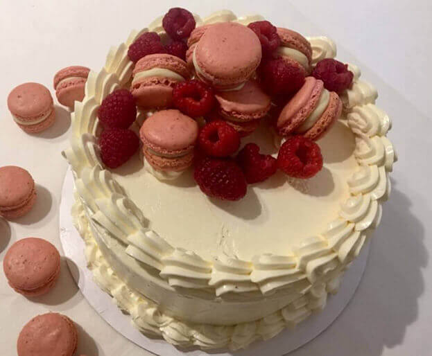 Golden Almond Butter Cake with White Chocolate Buttercream Fresh Raspberries and Raspberry Macarons