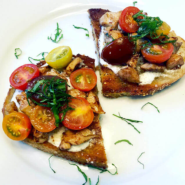 Balsamic chicken toast with mozzarella, cherry tomatoes, and basil