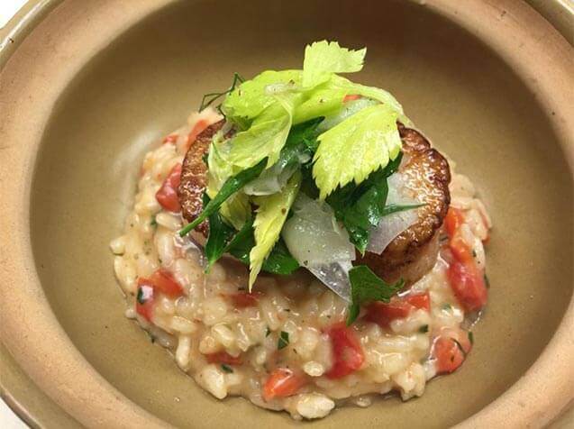 Seared scallops with red pepper risotto