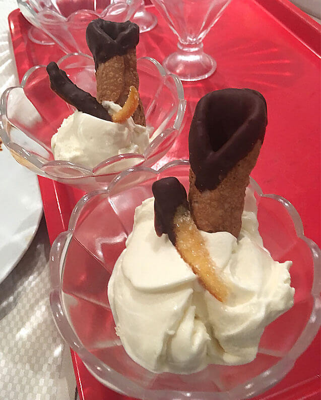 cannoli chocolate dipped gelato on red tablecloth